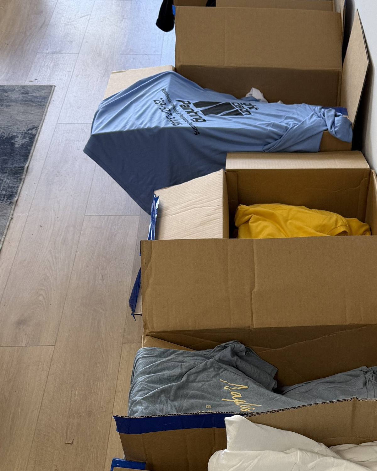 A row of finished orders boxed and ready to ship at our Naples shop