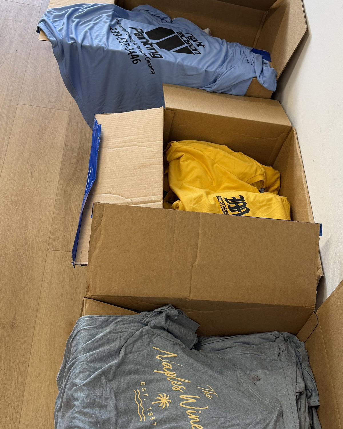 A row of finished crew orders boxed and ready to ship at our Naples shop
