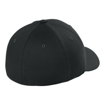 Black Flexfit 6277 fitted cap, rear three-quarter view showing the closed stretch-fit back